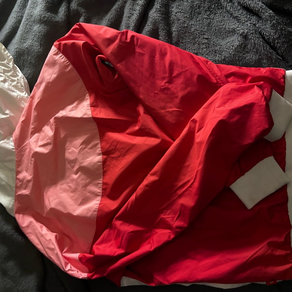 Pink red and white Nike windbreaker